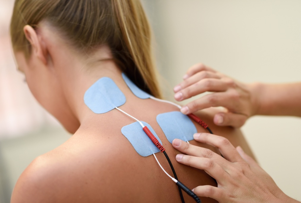 Therapist performing Electrotherapy procedure on a patient