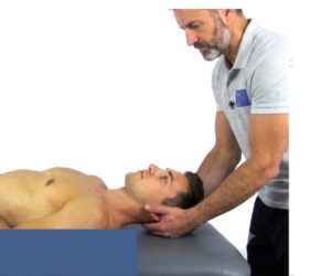 Therapist performing Cervical Distraction test to assess neck pain at Tam Physio & Rehab Clinic - Sharjah