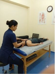 Female Physiotherapist performing manual therapy