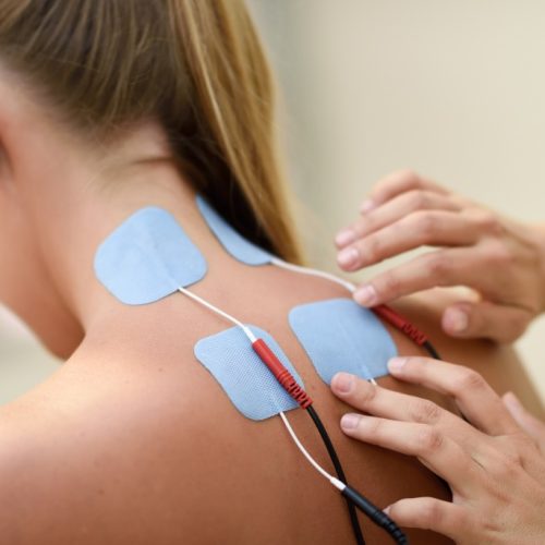 Therapist performing Electrotherapy procedure on a patient